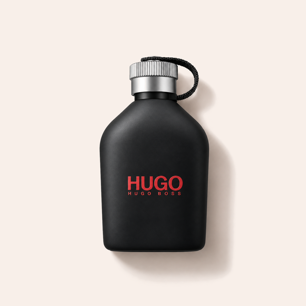 HUGO BOSS Hugo Just Different EDT 200 ml, flakon vleže na béžovém pozadí – MrRizz