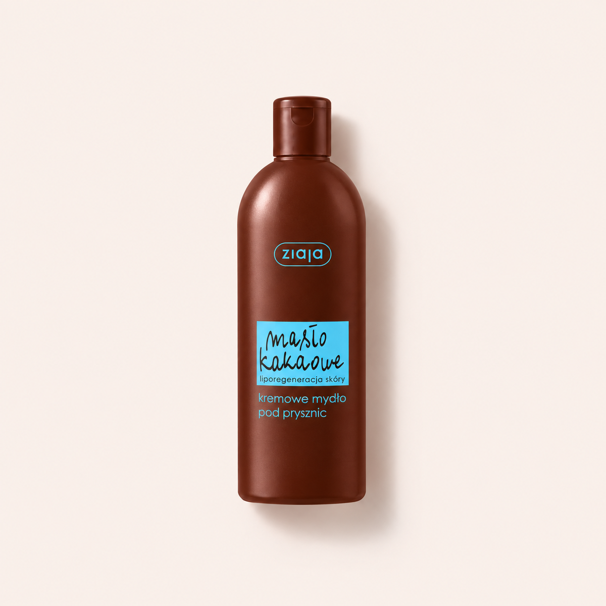 Ziaja Cocoa Butter sprchový krém 500 ml na béžovém pozadí – MrRizz