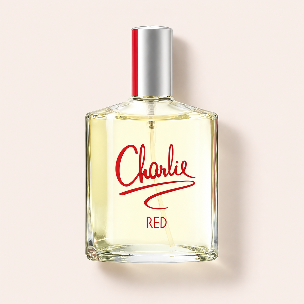 Revlon Charlie Red EDT 100 ml, průhledný flakon na růžovém pozadí – MrRizz